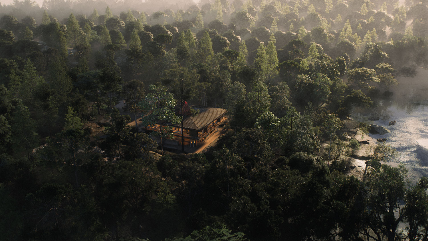 Aerial view of an architect Lombok villa surrounded by forest, with a river running alongside it.